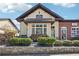 Charming building featuring a stone base, wood siding, and ample natural light at 2004 Cortland Rd, Milton, GA 30009