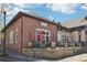 Brick building with a quaint storefront, sidewalk, and professional landscaping at 2004 Cortland Rd, Milton, GA 30009