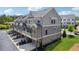 Upscale townhome community features private garages, balconies, and beautifully landscaped grounds at 2004 Cortland Rd, Milton, GA 30009