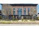 Three-story brick building with large arched windows and a modern storefront design at 2004 Cortland Rd, Milton, GA 30009