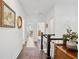 Well-lit hallway featuring hardwood floors and elegant decor leading to other rooms at 2004 Cortland Rd, Milton, GA 30009