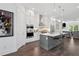 Modern kitchen featuring stainless steel appliances, quartz countertops, and an island with bar seating at 2004 Cortland Rd, Milton, GA 30009