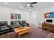 Spacious living room with a ceiling fan, plush seating, and ample natural light at 2004 Cortland Rd, Milton, GA 30009