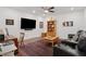Cozy living room featuring a ceiling fan, home theatre, and classic wood accents at 2004 Cortland Rd, Milton, GA 30009