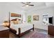 Spacious main bedroom with a four-poster bed, tray ceiling, and ample natural light at 2004 Cortland Rd, Milton, GA 30009