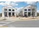 Exterior view of Lily Sushi Bar and The Nest, featuring modern storefronts and outdoor patio seating at 2004 Cortland Rd, Milton, GA 30009