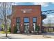 Front exterior of Six Bridges Brewing BBQ and Spirits, featuring a brick facade and modern design at 2004 Cortland Rd, Milton, GA 30009