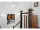 Elegant staircase with modern chandelier, dark wood, white risers, and decorative artwork at 2004 Cortland Rd, Milton, GA 30009