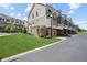 Modern townhomes with green lawns and well-kept landscaping near paved street at 2004 Cortland Rd, Milton, GA 30009