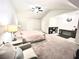 Bedroom with vaulted ceilings, ceiling fan, and a cozy sitting area at 2101 Adams Acres Dr, Lawrenceville, GA 30043