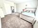 Neutral bedroom with a bed, mirror, and plenty of closet space at 2101 Adams Acres Dr, Lawrenceville, GA 30043