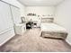 Bedroom featuring a bed, desk area, and natural light at 2101 Adams Acres Dr, Lawrenceville, GA 30043