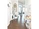 Charming entryway features hardwood floors, decoratively adorned walls and neutral paint at 2101 Adams Acres Dr, Lawrenceville, GA 30043