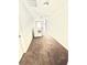 Hallway showcasing neutral carpet, white walls, base boards, and trim, and a linen closet at 2101 Adams Acres Dr, Lawrenceville, GA 30043