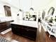 Spacious kitchen features large granite island, stainless appliances, and view to backyard at 2101 Adams Acres Dr, Lawrenceville, GA 30043