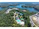 Beautiful aerial view of community amenities including pool, tennis courts, and lake access at 226 Crescent Moon Way, Canton, GA 30114