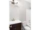 Bathroom includes single sink vanity, shower and tub combination and updated fixtures at 226 Crescent Moon Way, Canton, GA 30114