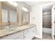 Elegant bathroom featuring dual glass vessel sinks, granite counters, and a tiled shower/tub at 226 Crescent Moon Way, Canton, GA 30114