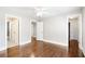 Spacious and bright bedroom with hardwood floors, doors to other rooms, and neutral paint at 226 Crescent Moon Way, Canton, GA 30114