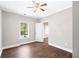 Bedroom with hardwood floors, crown molding, ceiling fan and a view of the outdoor pool at 226 Crescent Moon Way, Canton, GA 30114