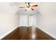 Cozy bedroom featuring hardwood floors, a ceiling fan, and ample closet space at 226 Crescent Moon Way, Canton, GA 30114