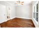 Bedroom features hardwood floors, natural light, and doorway to the bathroom at 226 Crescent Moon Way, Canton, GA 30114