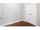 Simple bedroom featuring hardwood floors and a closet, providing essential comfort at 226 Crescent Moon Way, Canton, GA 30114