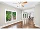 Cozy breakfast nook with hardwood floors, view of the deck and access to the living room at 226 Crescent Moon Way, Canton, GA 30114