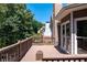 Exterior deck with wooded view, glass doors, and railings perfect for outdoor enjoyment at 226 Crescent Moon Way, Canton, GA 30114