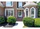 Charming brick home featuring manicured landscaping, elegant entryway, and classic architectural details at 226 Crescent Moon Way, Canton, GA 30114