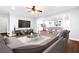Comfortable living room featuring an open layout, modern furniture, and hardwood flooring at 226 Crescent Moon Way, Canton, GA 30114