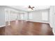 Spacious living room featuring hardwood floors, white columns, and plenty of natural light at 226 Crescent Moon Way, Canton, GA 30114