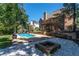 Beautiful backyard with a pool and fire pit at 226 Crescent Moon Way, Canton, GA 30114