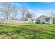 Spacious backyard featuring a well-maintained lawn, a modern building and a wood fence at 907 Oakhill Sw Ave, Atlanta, GA 30310