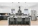 Modern kitchen featuring a waterfall island, stainless steel appliances, and stylish black and white cabinetry at 907 Oakhill Sw Ave, Atlanta, GA 30310