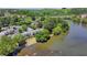Scenic aerial view of townhomes along a river, showcasing the waterfront living and lush greenery at 1119 Riverbend Club Se Dr, Atlanta, GA 30339