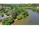 An aerial view showcasing the river running beside the complex, set among lush trees at 1119 Riverbend Club Se Dr, Atlanta, GA 30339