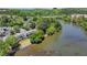 An aerial view showcasing the river running beside the complex, set among lush trees at 1119 Riverbend Club Se Dr, Atlanta, GA 30339