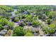 An aerial view showcasing the complex layout, set among lush trees and a river at 1119 Riverbend Club Se Dr, Atlanta, GA 30339