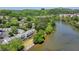 Scenic aerial view of townhomes along a river, showcasing the waterfront living and lush greenery at 1119 Riverbend Club Se Dr, Atlanta, GA 30339