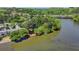An aerial view showcasing the river running beside the complex, set among lush trees at 1119 Riverbend Club Se Dr, Atlanta, GA 30339