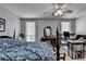 Cozy bedroom with a ceiling fan and windows creates a relaxing atmosphere at 1119 Riverbend Club Se Dr, Atlanta, GA 30339