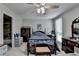 Inviting bedroom with a view to the bathroom, comfortable bed, and wooden furniture at 1119 Riverbend Club Se Dr, Atlanta, GA 30339