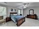 Comfortable bedroom features a ceiling fan, dresser, and a serene atmosphere for relaxation at 1119 Riverbend Club Se Dr, Atlanta, GA 30339