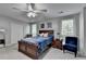Cozy bedroom with ceiling fan, and carpet floors offers a relaxing retreat at 1119 Riverbend Club Se Dr, Atlanta, GA 30339
