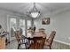 This dining area offers a cozy space for Gathering meals with a view of the backyard at 1119 Riverbend Club Se Dr, Atlanta, GA 30339