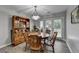 The dining area features a wooden table and chairs with natural light from the patio doors at 1119 Riverbend Club Se Dr, Atlanta, GA 30339