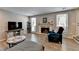 Bright living room featuring a fireplace, light gray walls, and wood-look floors at 1119 Riverbend Club Se Dr, Atlanta, GA 30339