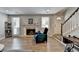 Open living room with fireplace, wood-look floors, and a staircase at 1119 Riverbend Club Se Dr, Atlanta, GA 30339