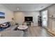 Comfortable living room with hardwood floors, decorative fireplace, and bright natural light at 1119 Riverbend Club Se Dr, Atlanta, GA 30339
